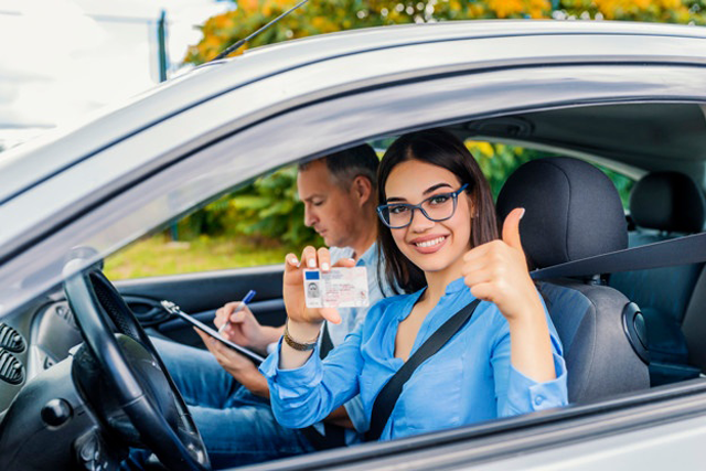 new driver proudly shows license