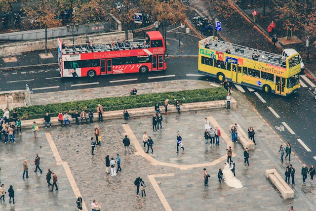 tourists gather near city buses